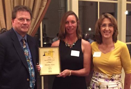 Coach Stone with award 